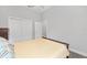 Bedroom featuring wood floors, ceiling fan and ensuite access at 9063 Sw 59Th Lane Rd, Ocala, FL 34481