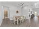 Open dining area with modern lighting fixture and easy access to bathroom and other living spaces at 9063 Sw 59Th Lane Rd, Ocala, FL 34481