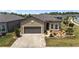 Charming single-story home with well-manicured landscaping and a two-car garage at 9063 Sw 59Th Lane Rd, Ocala, FL 34481