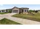A well-maintained lawn and landscaped garden beds accentuate the home's curb appeal at 9063 Sw 59Th Lane Rd, Ocala, FL 34481