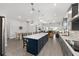 Open concept kitchen with gray cabinets, stainless steel appliances, and an island perfect for entertaining at 9063 Sw 59Th Lane Rd, Ocala, FL 34481