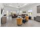 Spacious living room with tray ceilings, recessed lighting, and seamless access to the kitchen at 9063 Sw 59Th Lane Rd, Ocala, FL 34481