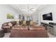 Inviting living area showcasing a modern design with a comfortable seating arrangement and open floor plan at 9063 Sw 59Th Lane Rd, Ocala, FL 34481