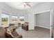 Inviting living room showcasing multiple windows and wood-look floors at 9063 Sw 59Th Lane Rd, Ocala, FL 34481