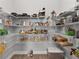 Walk-in pantry features wire shelving, providing ample storage for food and kitchen essentials at 9063 Sw 59Th Lane Rd, Ocala, FL 34481