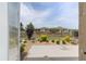 View from a doorway of a well-maintained backyard with a gravel border, tidy shrubs, and a black metal fence at 9063 Sw 59Th Lane Rd, Ocala, FL 34481