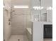 Walk in shower with glass enclosure with tiled walls and floors at 9063 Sw 59Th Lane Rd, Ocala, FL 34481