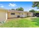The backyard is large with grass and an exterior of the home at 9333 Sw 97Th Pl # C, Ocala, FL 34481