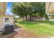 Spacious backyard with well-maintained lawn, mature trees, and a view of neighboring homes at 9333 Sw 97Th Pl # C, Ocala, FL 34481