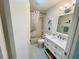 Clean and well-lit bathroom with a vanity, mirror, and a shower-tub combination at 9333 Sw 97Th Pl # C, Ocala, FL 34481