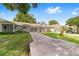 Charming single story home with a screened in garage, well manicured lawn, and ample parking on the driveway at 9333 Sw 97Th Pl # C, Ocala, FL 34481