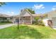 Charming single-story home featuring a well-maintained lawn and inviting front porch at 9333 Sw 97Th Pl # C, Ocala, FL 34481