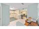 Well-maintained kitchen with ample cabinet space, white countertops, and a view into the living area at 9333 Sw 97Th Pl # C, Ocala, FL 34481