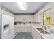 Bright kitchen with ample cabinets and modern appliances at 9333 Sw 97Th Pl # C, Ocala, FL 34481