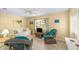 Cozy living room featuring comfortable seating, a ceiling fan, and natural light at 9333 Sw 97Th Pl # C, Ocala, FL 34481