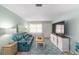 Relaxing living room featuring a sofa, TV, and stylish decor at 9333 Sw 97Th Pl # C, Ocala, FL 34481
