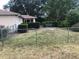 Fenced backyard featuring a patio set and privacy bushes and fence at 9896 Sw 61St Ct, Ocala, FL 34476