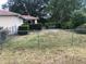 Fenced backyard featuring a patio set and privacy bushes and fence at 9896 Sw 61St Ct, Ocala, FL 34476
