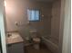 Bathroom features standard toilet, sink, vanity, and bathtub with tile backsplash at 9896 Sw 61St Ct, Ocala, FL 34476