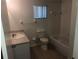 Bathroom features standard toilet, sink, vanity, and bathtub with tile backsplash at 9896 Sw 61St Ct, Ocala, FL 34476