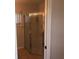 Bathroom with tile flooring, shower, and window providing natural light at 9896 Sw 61St Ct, Ocala, FL 34476