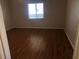 Bedroom with a wood flooring and a window at 9896 Sw 61St Ct, Ocala, FL 34476