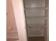 Bathroom closet with wire shelving and white walls at 9896 Sw 61St Ct, Ocala, FL 34476