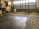 View of the garage with concrete flooring at 9896 Sw 61St Ct, Ocala, FL 34476