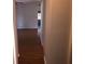Hallway with hardwood floors leading to living room at 9896 Sw 61St Ct, Ocala, FL 34476