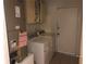 Utility room equipped with appliances, overhead cabinets, and a door to the exterior at 9896 Sw 61St Ct, Ocala, FL 34476