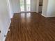 Spacious living room with hardwood floors, French doors, and natural light at 9896 Sw 61St Ct, Ocala, FL 34476