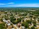 Scenic aerial view of the neighborhood, showcasing the mature trees and surrounding greenery at 10824 Sw 90Th Ter, Ocala, FL 34481