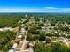 Aerial view of home in a lush, green neighborhood with mature trees at 10824 Sw 90Th Ter, Ocala, FL 34481