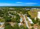 An aerial view showcases this residential neighborhood, with mature trees dotting the landscape at 10824 Sw 90Th Ter, Ocala, FL 34481