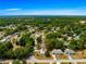 Overhead view of property surrounded by mature trees in quiet neighborhood at 10824 Sw 90Th Ter, Ocala, FL 34481