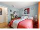 Bedroom features cozy decor, colorful walls, comfortable furniture, and plenty of natural light at 10824 Sw 90Th Ter, Ocala, FL 34481