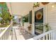 Inviting front porch with rocking chairs and decorative plants at 10824 Sw 90Th Ter, Ocala, FL 34481