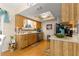 Charming kitchen features wooden cabinets, modern appliances, and a bright, airy atmosphere at 10824 Sw 90Th Ter, Ocala, FL 34481