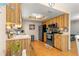 Bright kitchen features modern appliances, hardwood flooring, and plenty of cabinet space at 10824 Sw 90Th Ter, Ocala, FL 34481