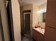 Bathroom with walk in shower and single sink vanity at 10980 Sw 63Rd Ave, Ocala, FL 34476
