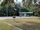 Community recreation area with bocce ball court, covered picnic tables, and ample seating at 10980 Sw 63Rd Ave, Ocala, FL 34476
