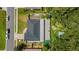 Aerial view showcasing the house, driveway, surrounding greenery, and nearby street at 1109 Ne 22Nd Ave, Ocala, FL 34470