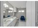 Bathroom boasts double sinks, a modern vanity, and stylish tile flooring at 1109 Ne 22Nd Ave, Ocala, FL 34470
