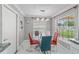 Bright dining area with stylish lighting and large windows offers a welcoming space at 1109 Ne 22Nd Ave, Ocala, FL 34470