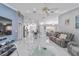 Bright living area showcasing marble floors, sleek furniture, and an open floor plan at 1109 Ne 22Nd Ave, Ocala, FL 34470