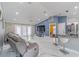 Open living space with marble floors, modern furniture, and easy access to the outdoor patio at 1109 Ne 22Nd Ave, Ocala, FL 34470