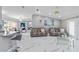 Expansive living room with marble floors, stylish decor, and an open layout at 1109 Ne 22Nd Ave, Ocala, FL 34470