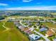 Picturesque aerial shot of a home located in a community with a golf course and serene lakes at 11799 Se 173Rd Lane Rd, Summerfield, FL 34491