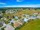 Expansive aerial view of a charming home nestled near a golf course in a vibrant community at 11799 Se 173Rd Lane Rd, Summerfield, FL 34491