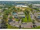 Beautiful aerial view of a community with large pool, clubhouse, and manicured landscaping at 11799 Se 173Rd Lane Rd, Summerfield, FL 34491
